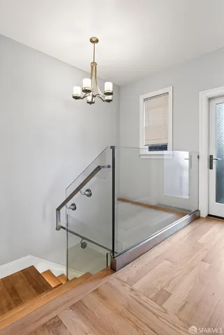 a bathroom with a granite countertop sink toilet a mirror a vanity and shower
