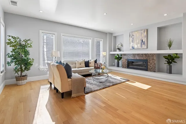 a view of a room with wooden floor and staircase