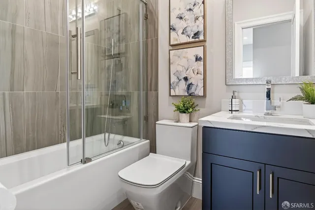 a bathroom with a double vanity sink a mirror and a shower