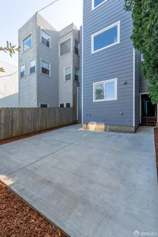 a kitchen with stainless steel appliances a refrigerator a stove top oven and a center island