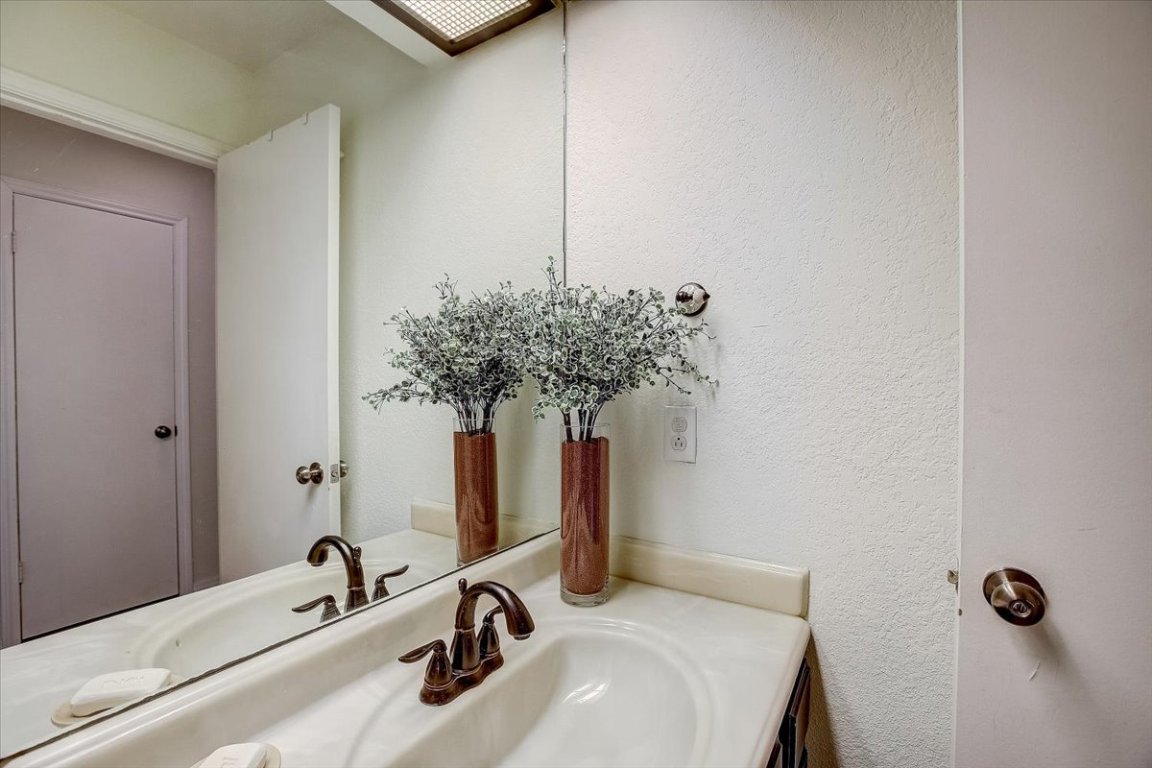 4711 Spicewood Springs Road, Unit 2112 Austin, TX 78759 - Photo 11 of 29 a bathroom with a sink and mirror