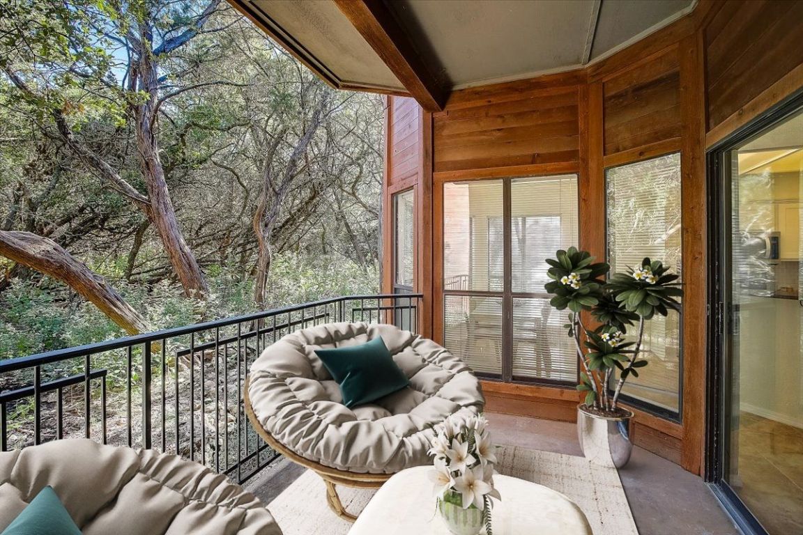 4711 Spicewood Springs Road, Unit 2112 Austin, TX 78759 - Photo 23 of 29 a living room with furniture and a large window