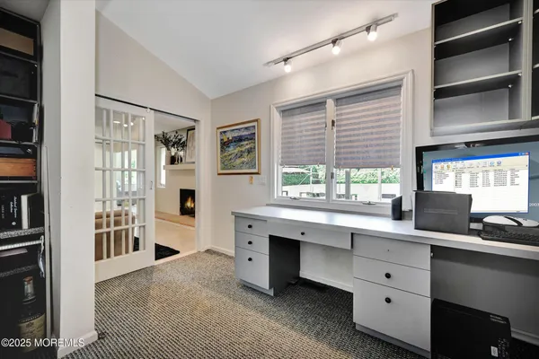 a kitchen with granite countertop a stove and cabinets