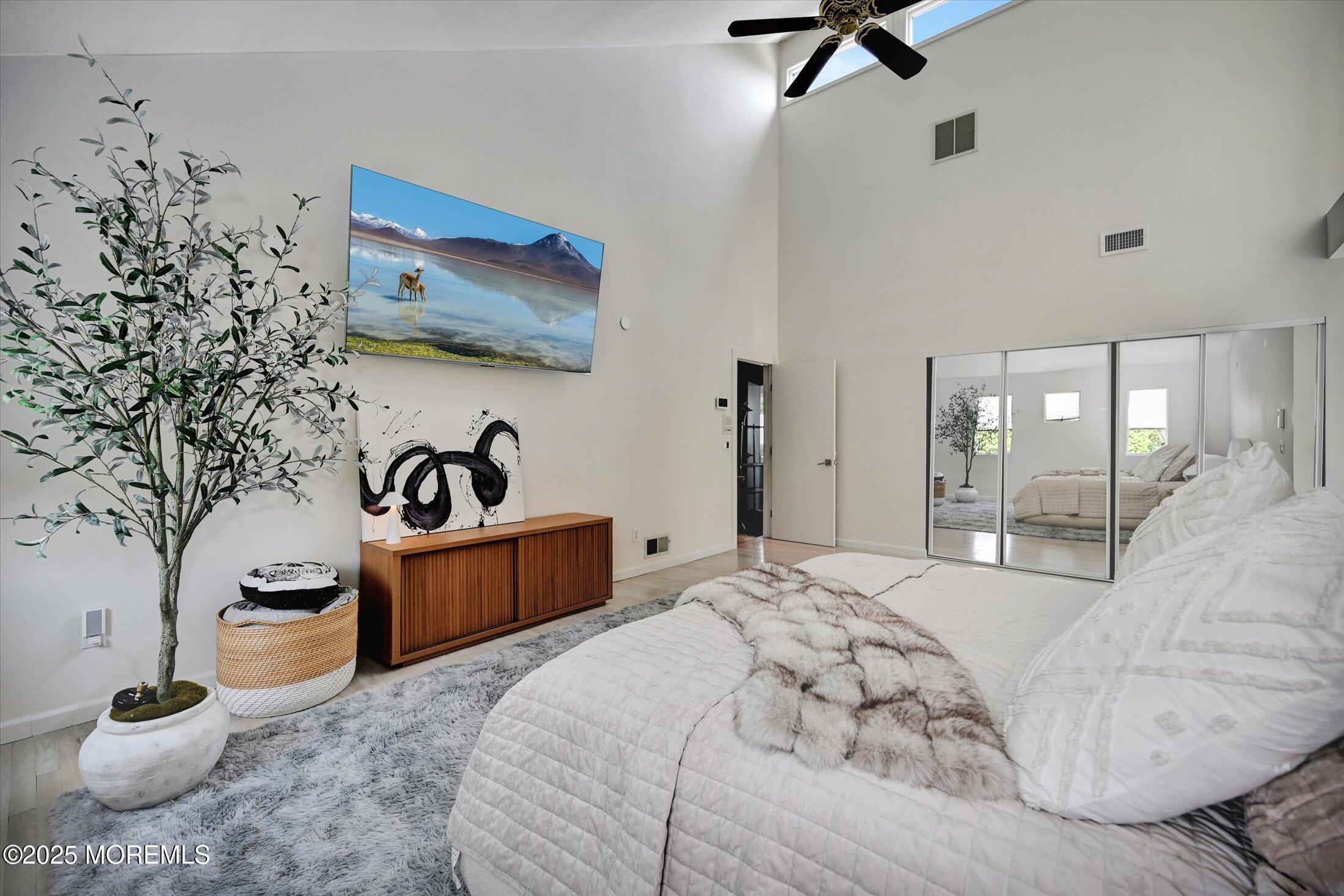 3 Woods Road West Long Branch, NJ 07764 - Photo 17 of 46 a bedroom with a bed and ceiling fan