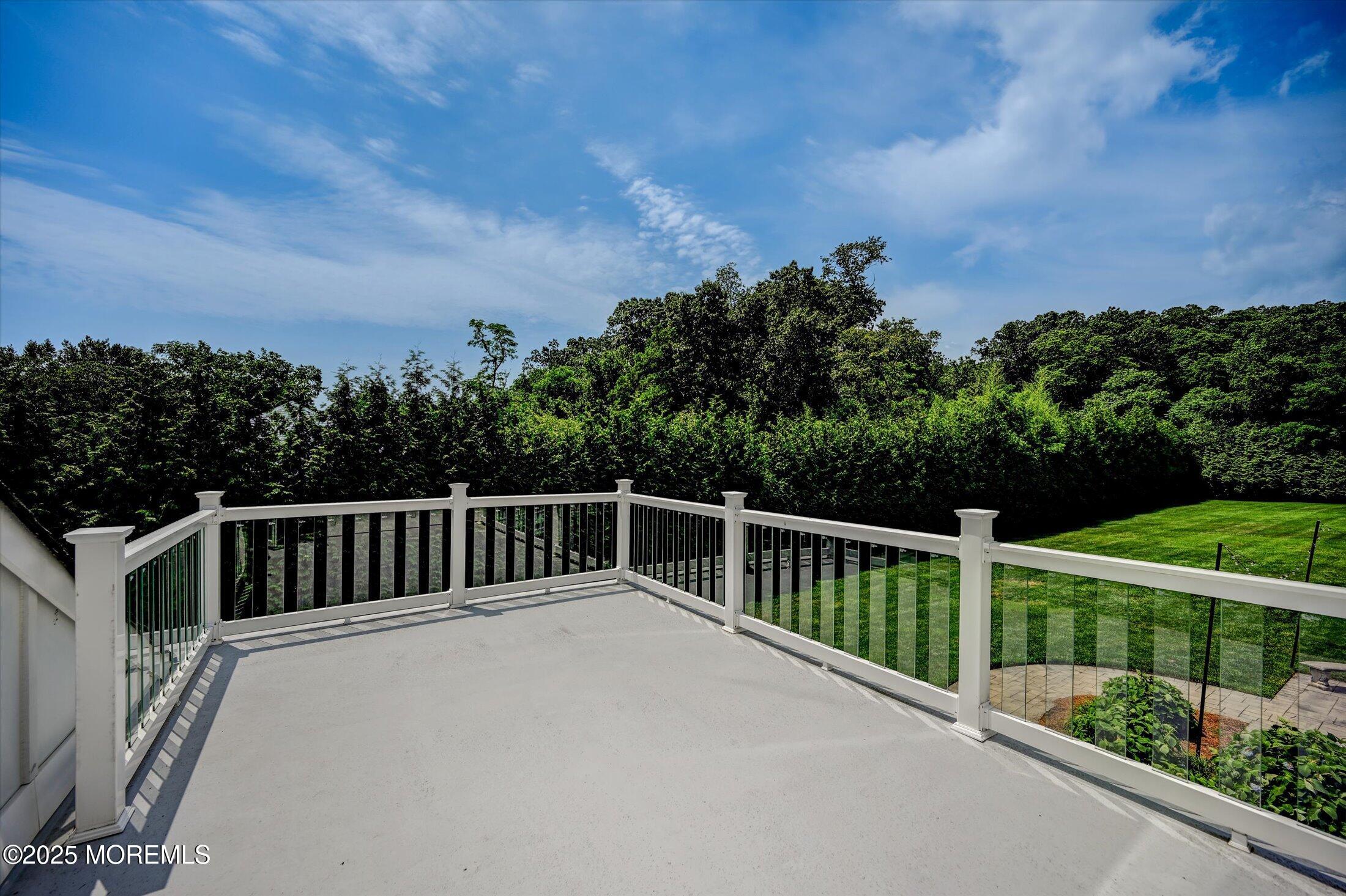 3 Woods Road West Long Branch, NJ 07764 - Photo 18 of 46 a balcony with view of trees in the background