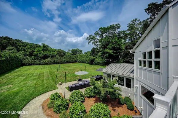 aerial view of a house with a yard