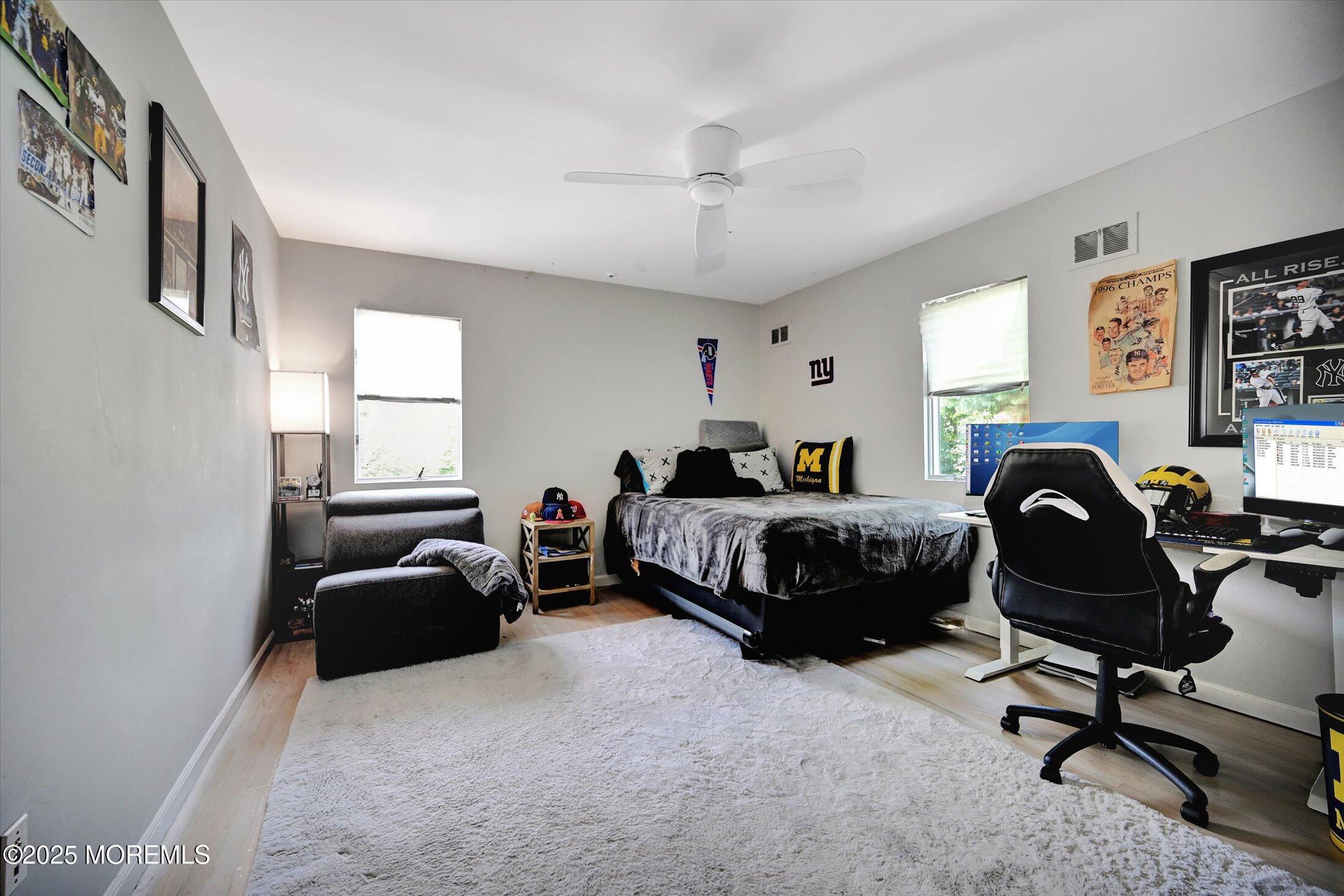 3 Woods Road West Long Branch, NJ 07764 - Photo 21 of 46 a bedroom with a bed chair and a window