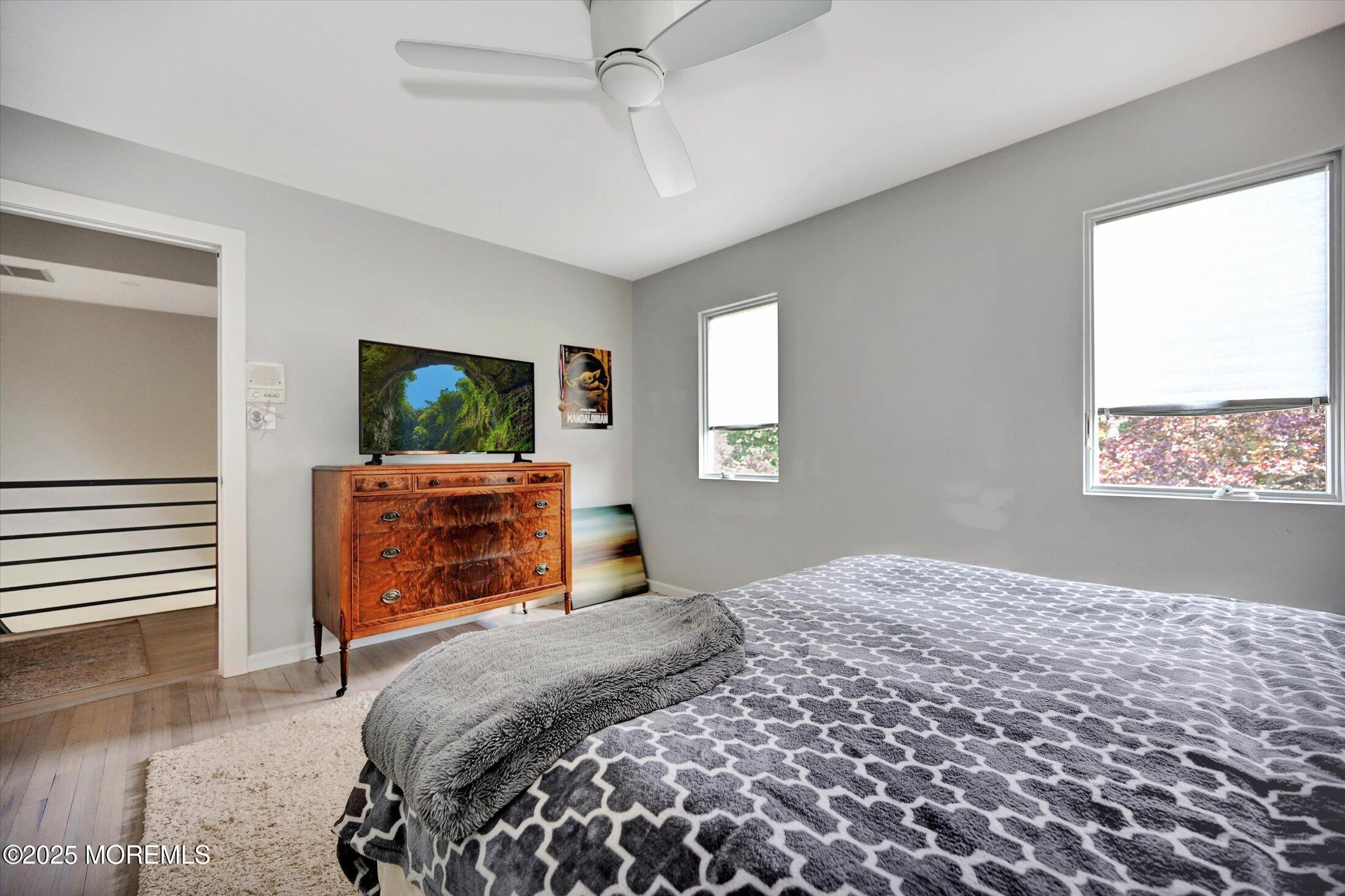 3 Woods Road West Long Branch, NJ 07764 - Photo 25 of 46 a bedroom with a bed and a television