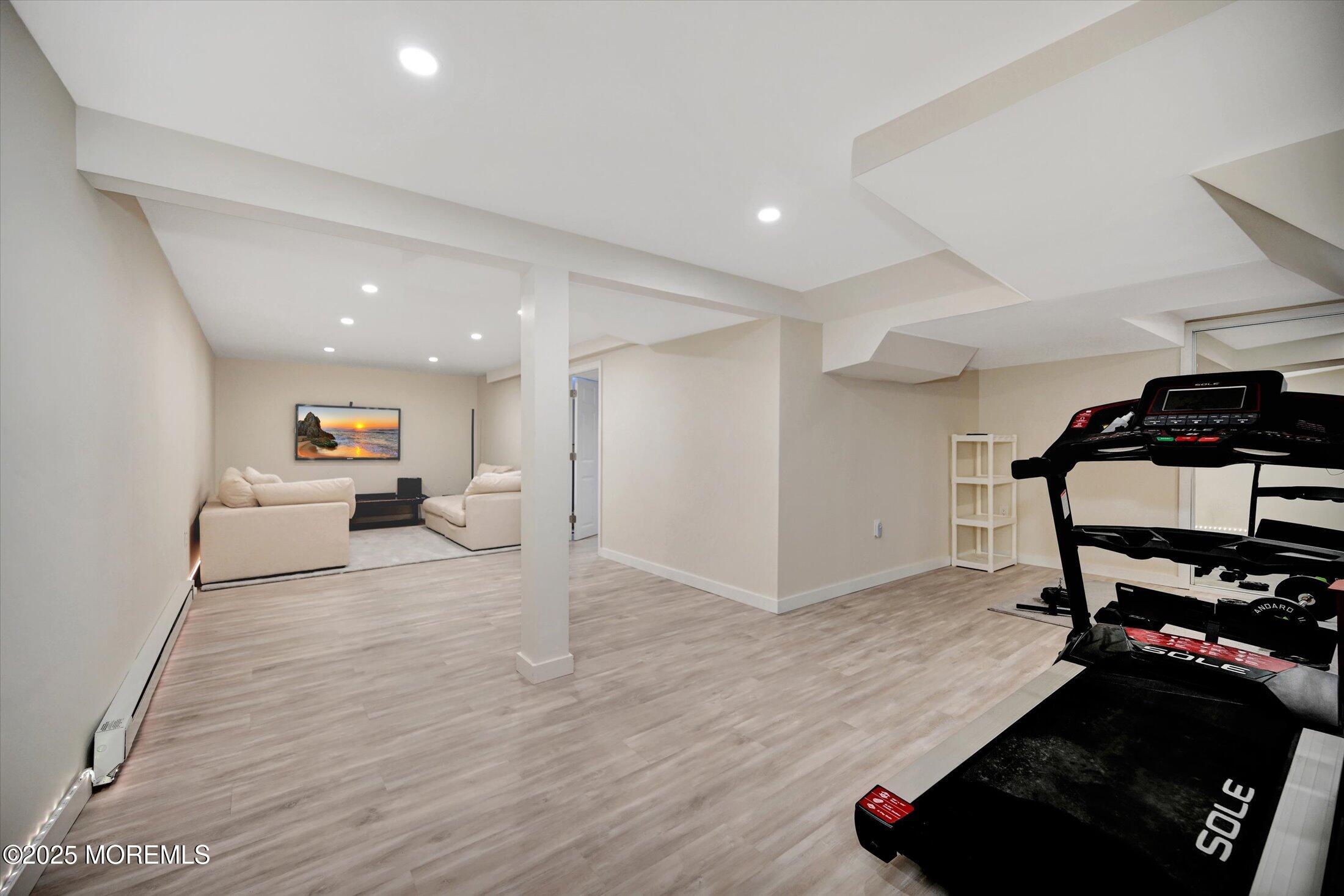 3 Woods Road West Long Branch, NJ 07764 - Photo 26 of 46 a living room with furniture and a wooden floor