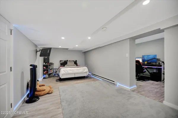 a living room with furniture and a gym equipment