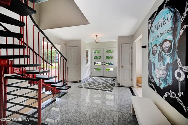 a view of an entryway with a hardwood