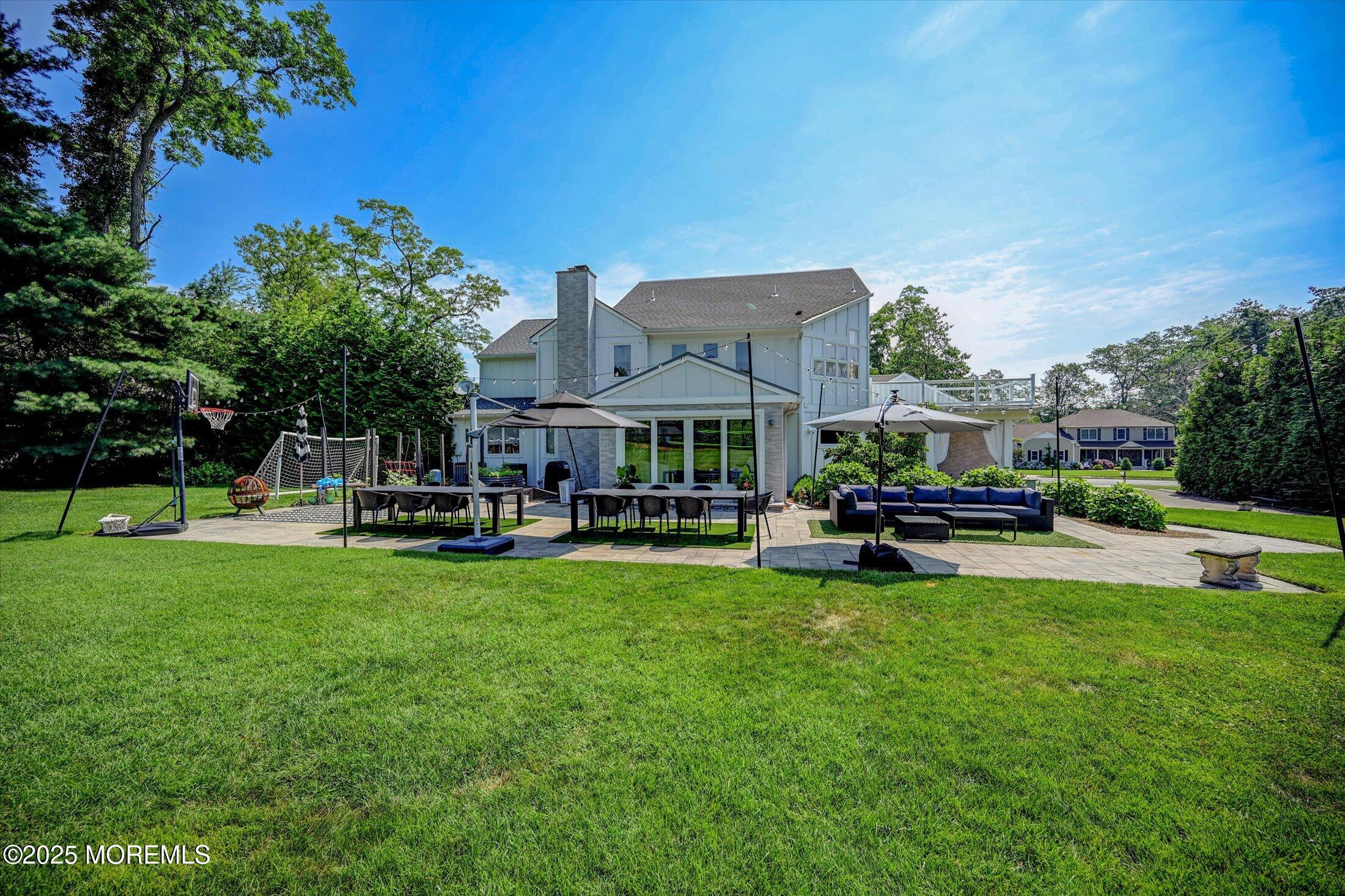 3 Woods Road West Long Branch, NJ 07764 - Photo 31 of 46 a view of a house with swimming pool and sitting area