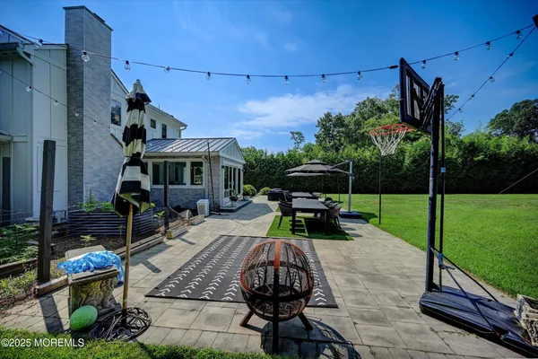 a view of backyard with sitting area