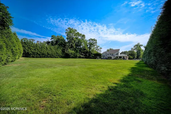 a view of a green field with clear sky