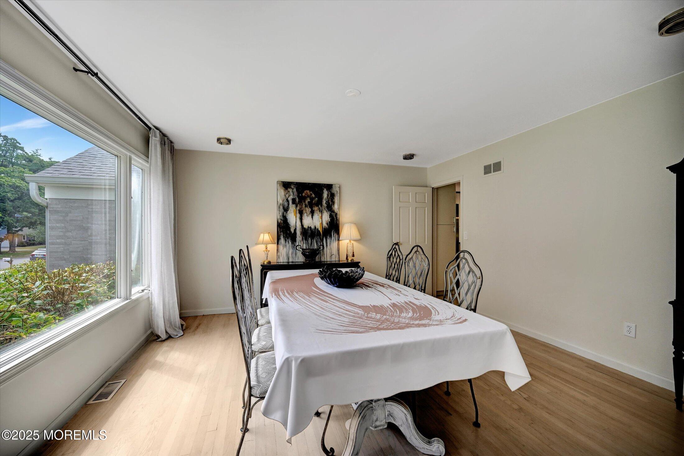 3 Woods Road West Long Branch, NJ 07764 - Photo 6 of 46 a view of a dining room with furniture and a window