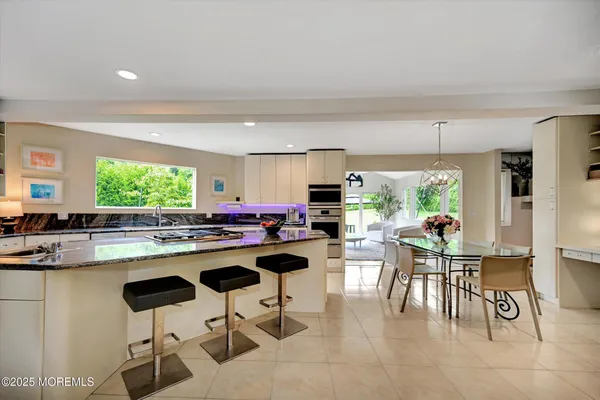 a kitchen with a table and chairs in it