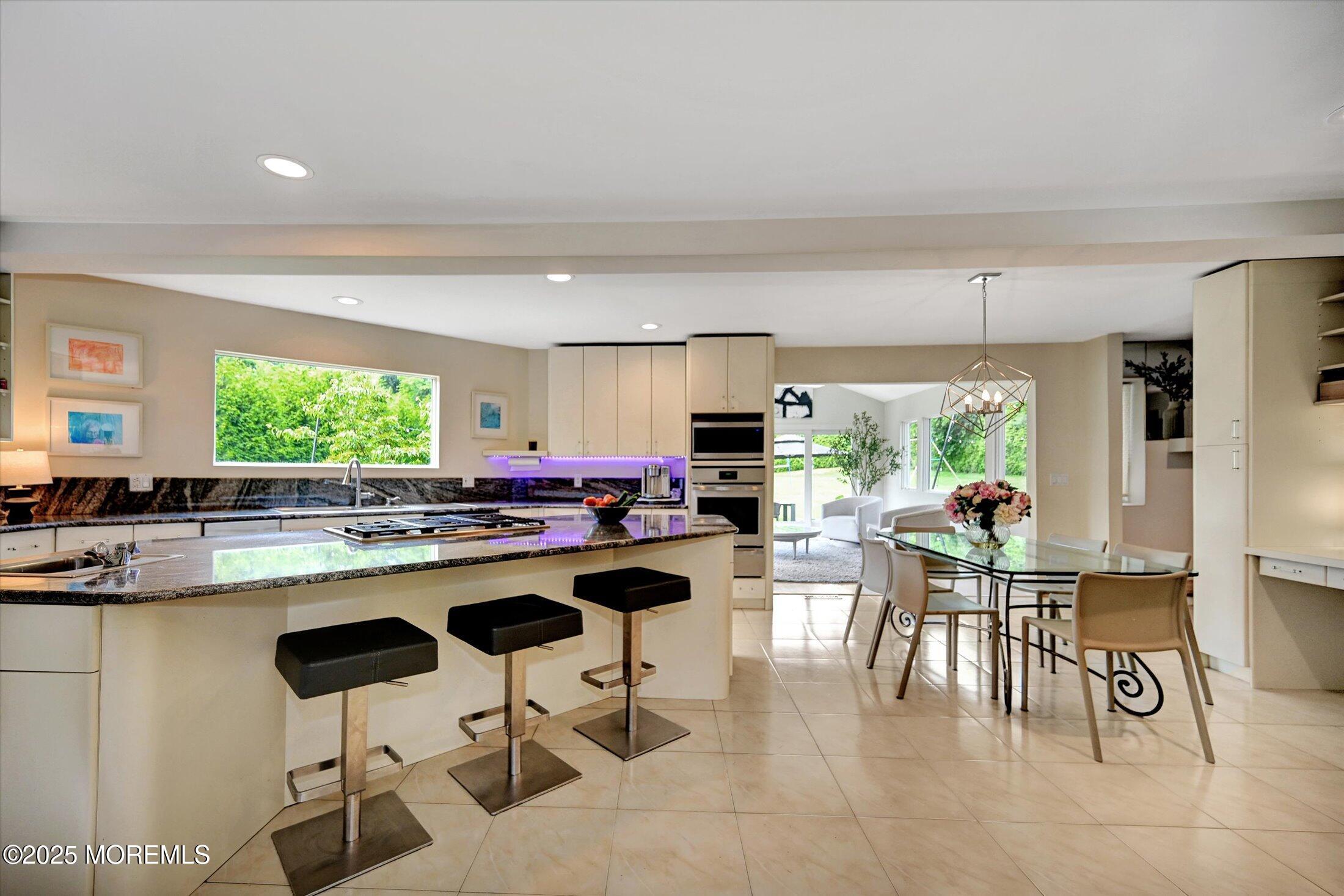 3 Woods Road West Long Branch, NJ 07764 - Photo 7 of 46 a kitchen with a table and chairs in it