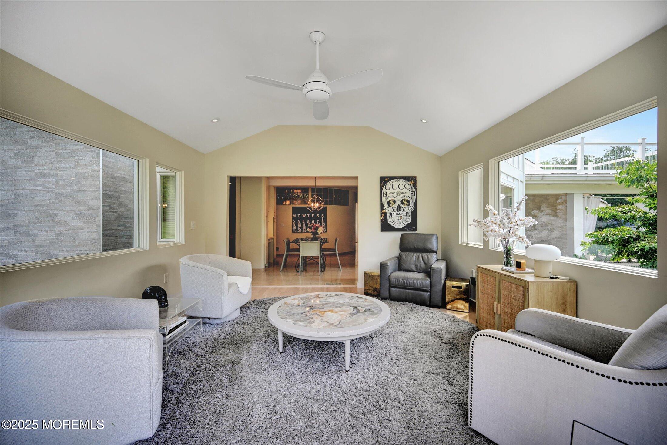 3 Woods Road West Long Branch, NJ 07764 - Photo 10 of 46 a living room with furniture and a large window