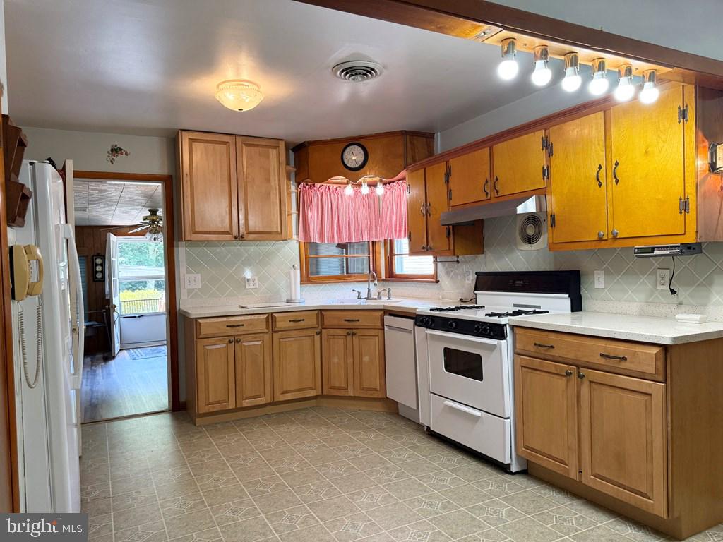664 Sandy Point Road Heathsville, VA 22473 - Photo 5 of 12 Charming kitchen with warm wood accents.