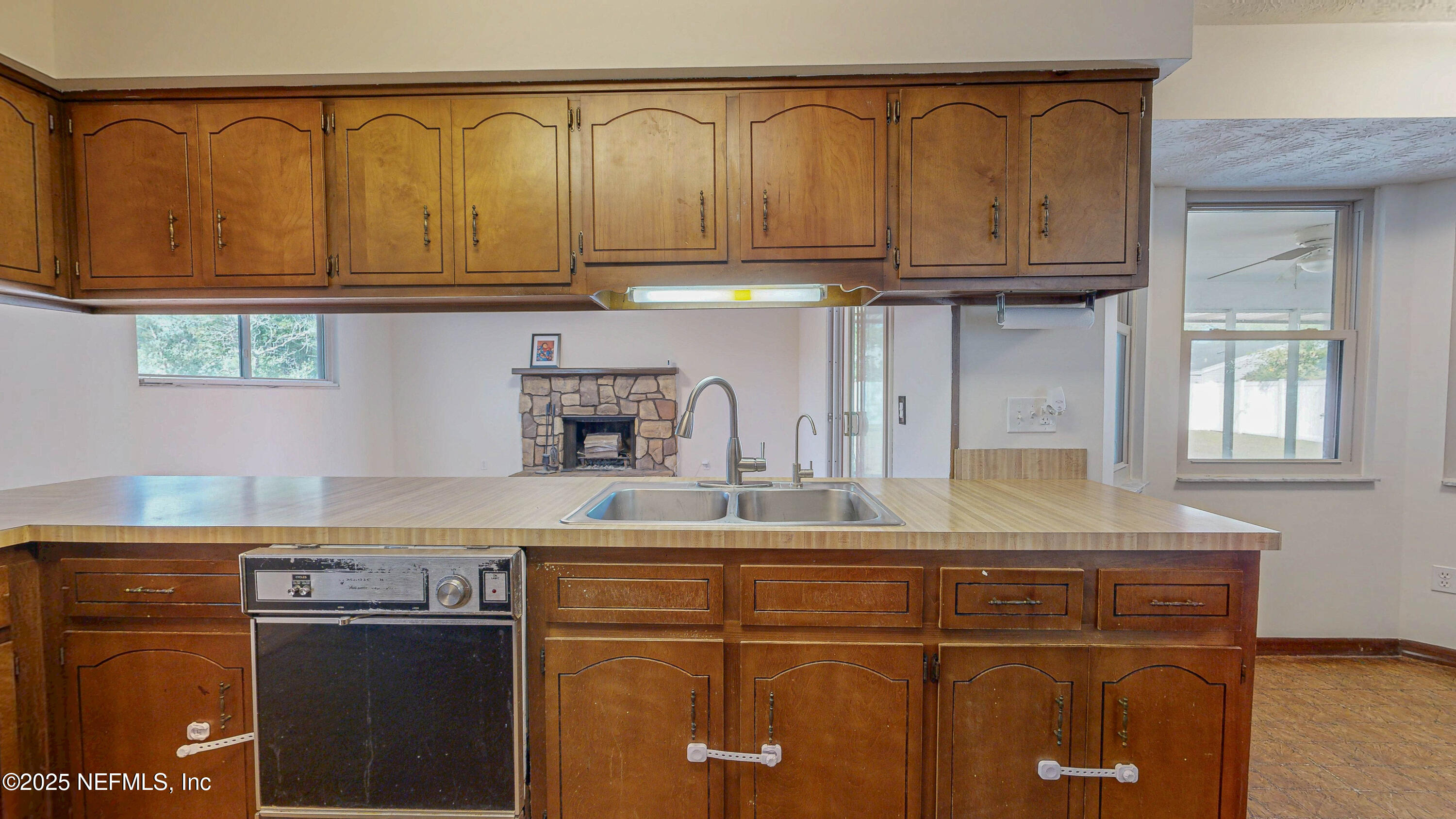 2474 Summer Tree Road East Jacksonville, FL 32246 - Photo 11 of 42 a kitchen with a sink and cabinets