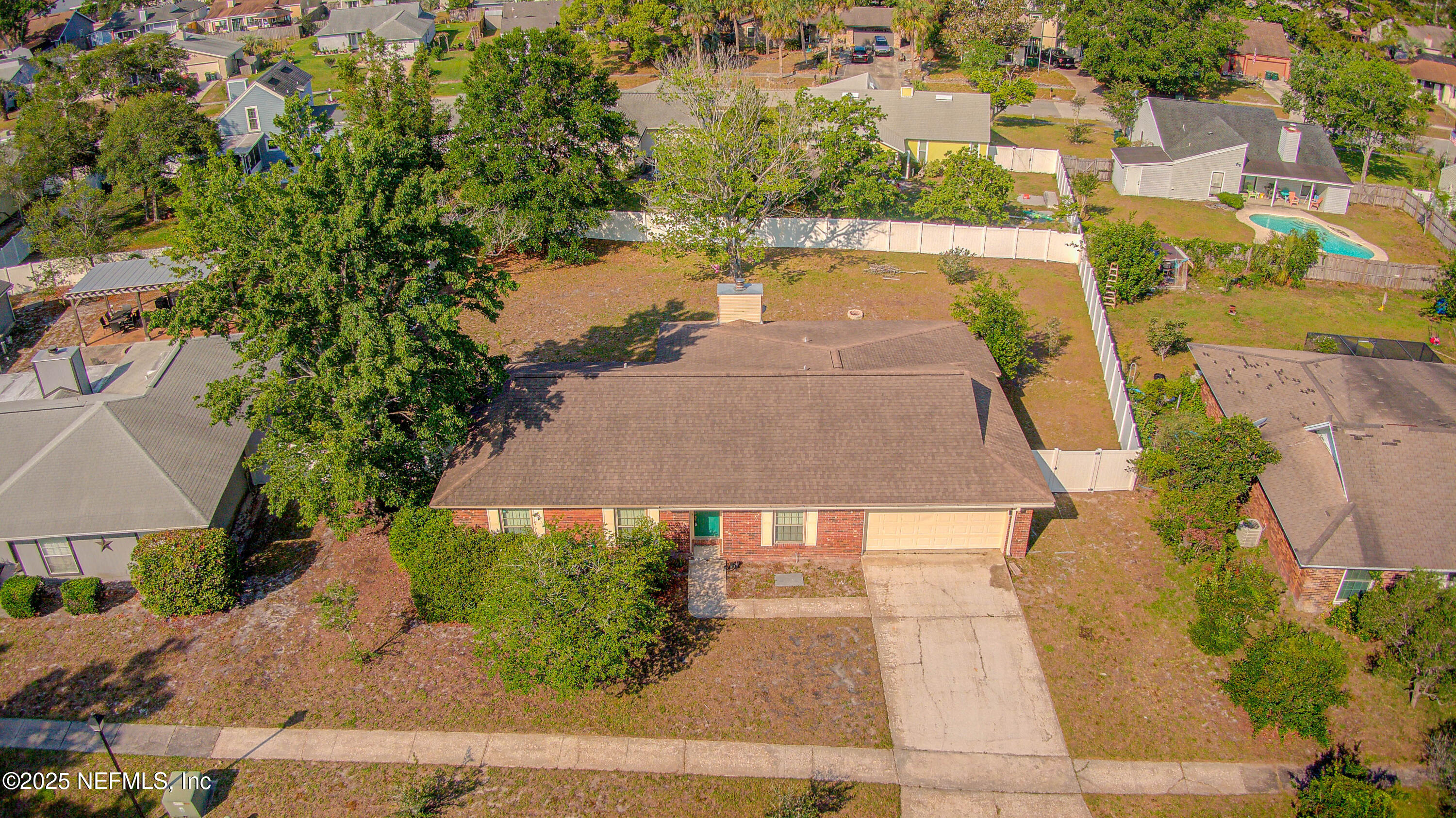 2474 Summer Tree Road East Jacksonville, FL 32246 - Photo 30 of 42 an aerial view of residential houses with yard