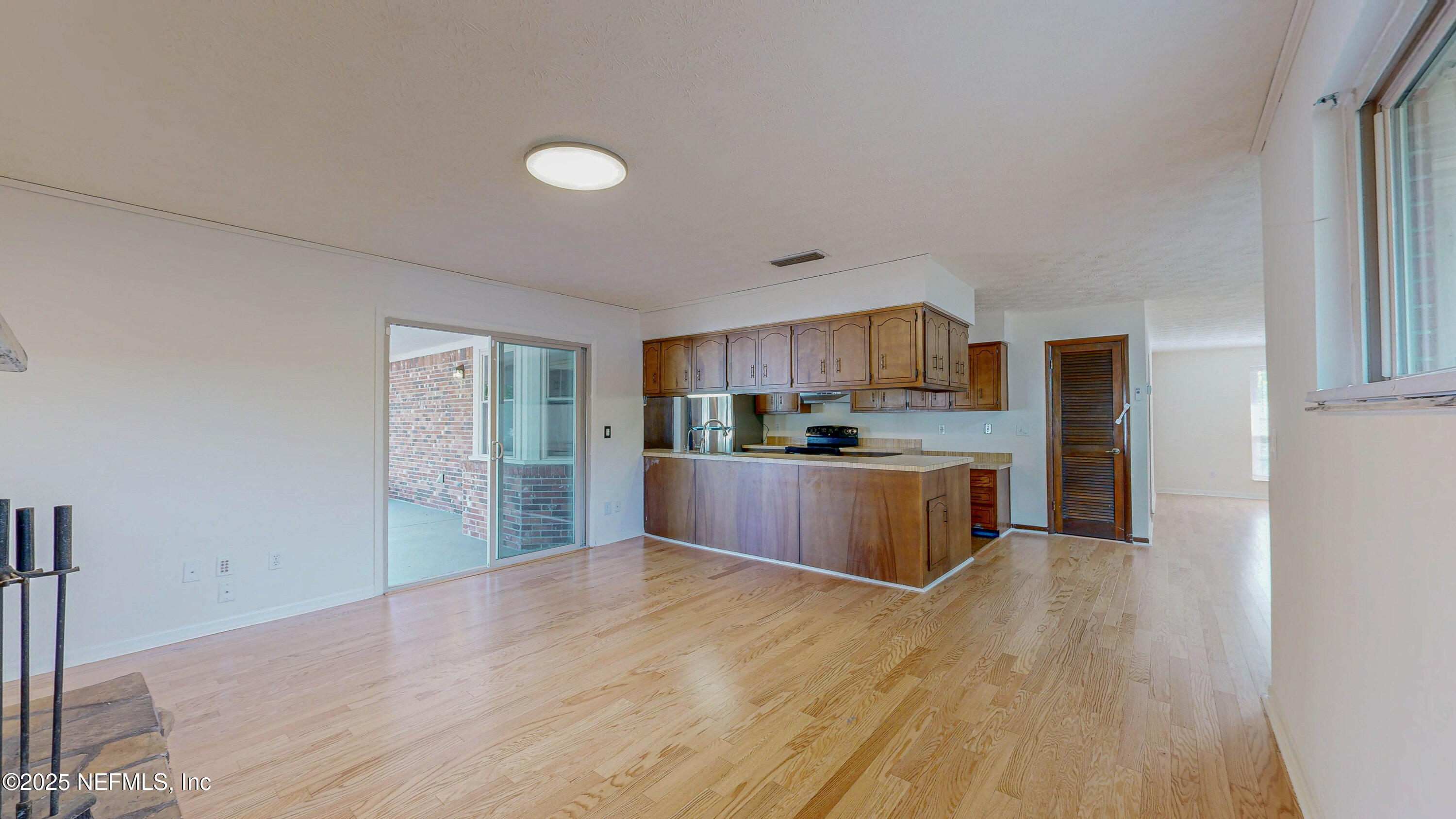 2474 Summer Tree Road East Jacksonville, FL 32246 - Photo 5 of 42 a kitchen with stainless steel appliances granite countertop a stove a sink dishwasher and a refrigerator with wooden floor