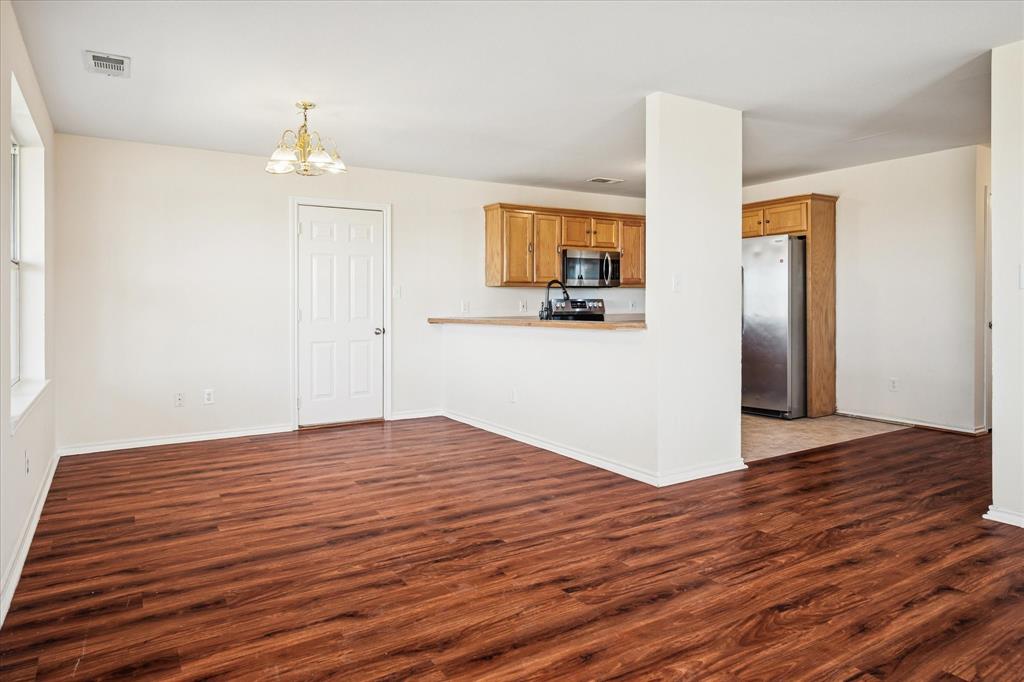 112 Sebastian Lane Josephine, TX 75173 - Photo 4 of 15 a view of empty room with wooden floor