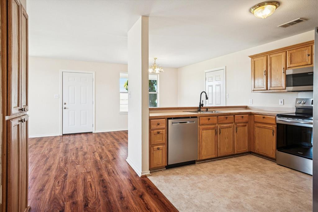 112 Sebastian Lane Josephine, TX 75173 - Photo 7 of 15 a kitchen with a sink and cabinets