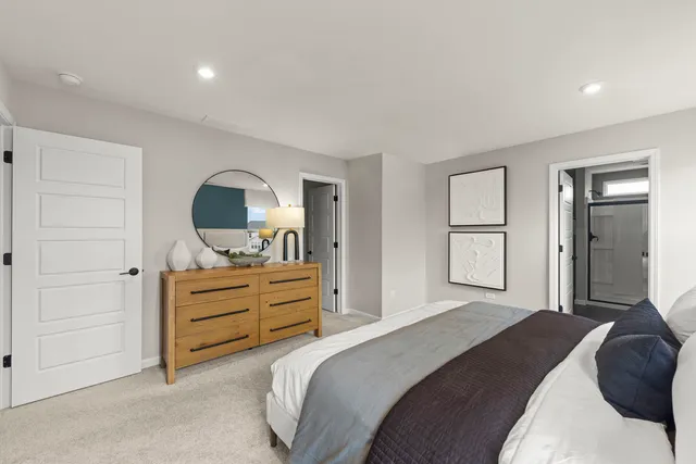 a bedroom with bed and window