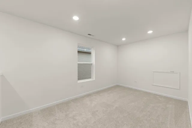 an empty room with a empty space and window