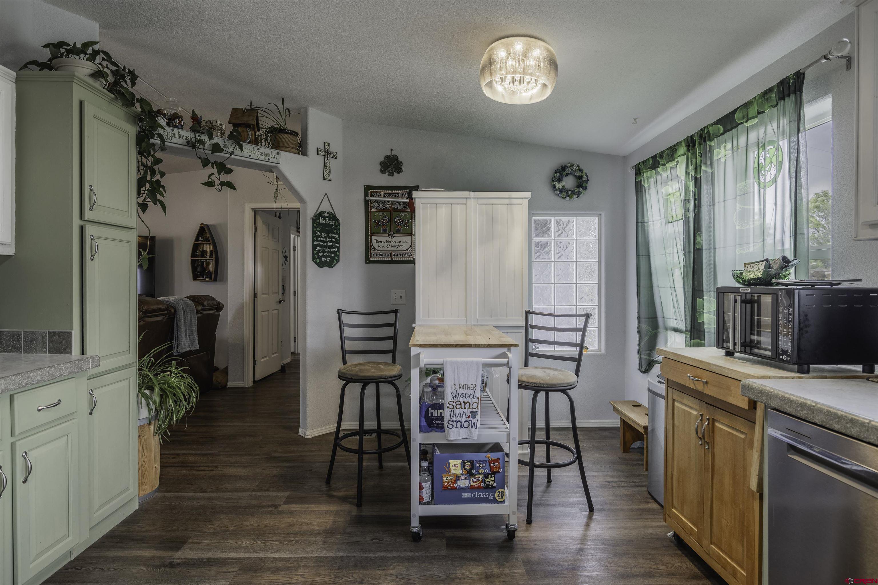 3847 5725th Road Olathe, CO 81425 - Photo 5 of 26 a view of a kitchen with furniture and a window
