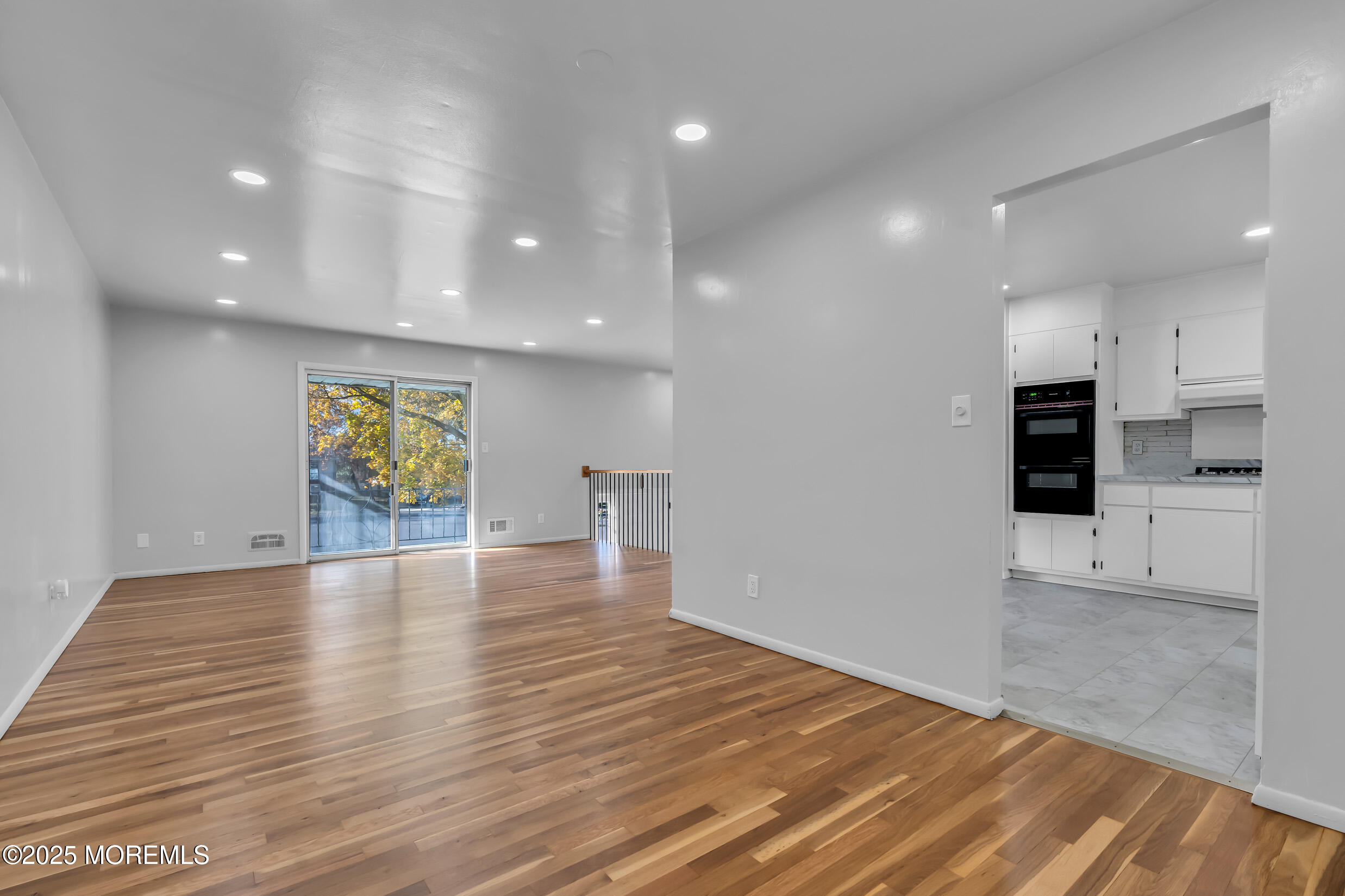16 Burdge Drive Howell, NJ 07731 - Photo 12 of 43 a view of an empty room with kitchen and window