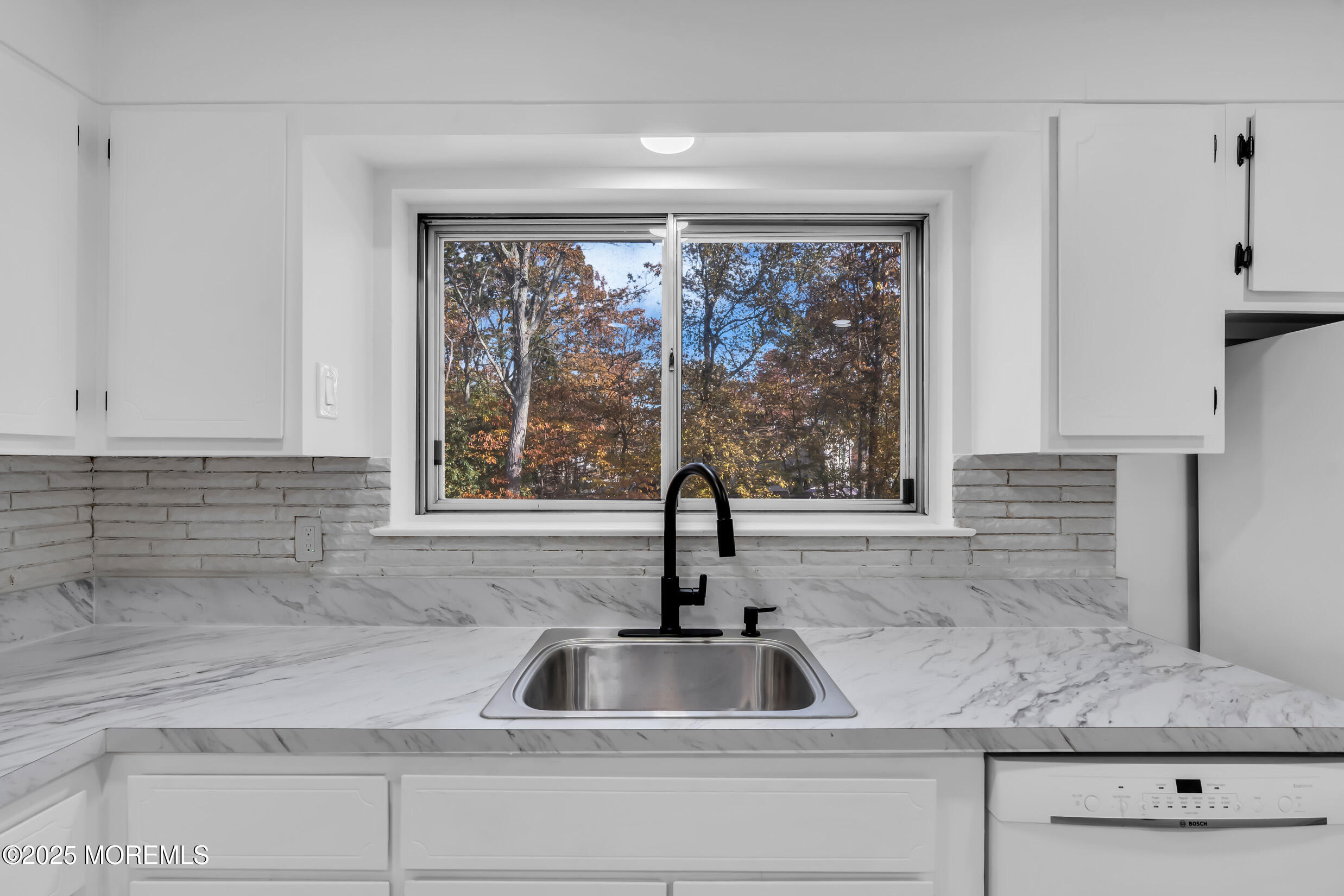 16 Burdge Drive Howell, NJ 07731 - Photo 15 of 43 a kitchen with granite countertop a sink and a window