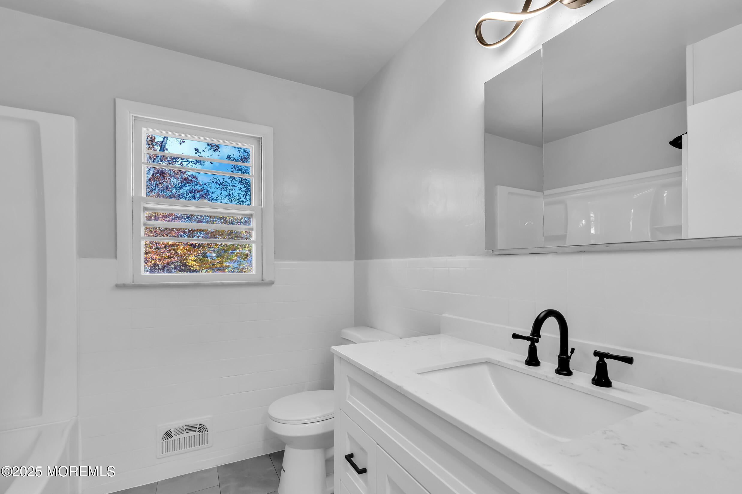 16 Burdge Drive Howell, NJ 07731 - Photo 18 of 43 a bathroom with a toilet and a sink