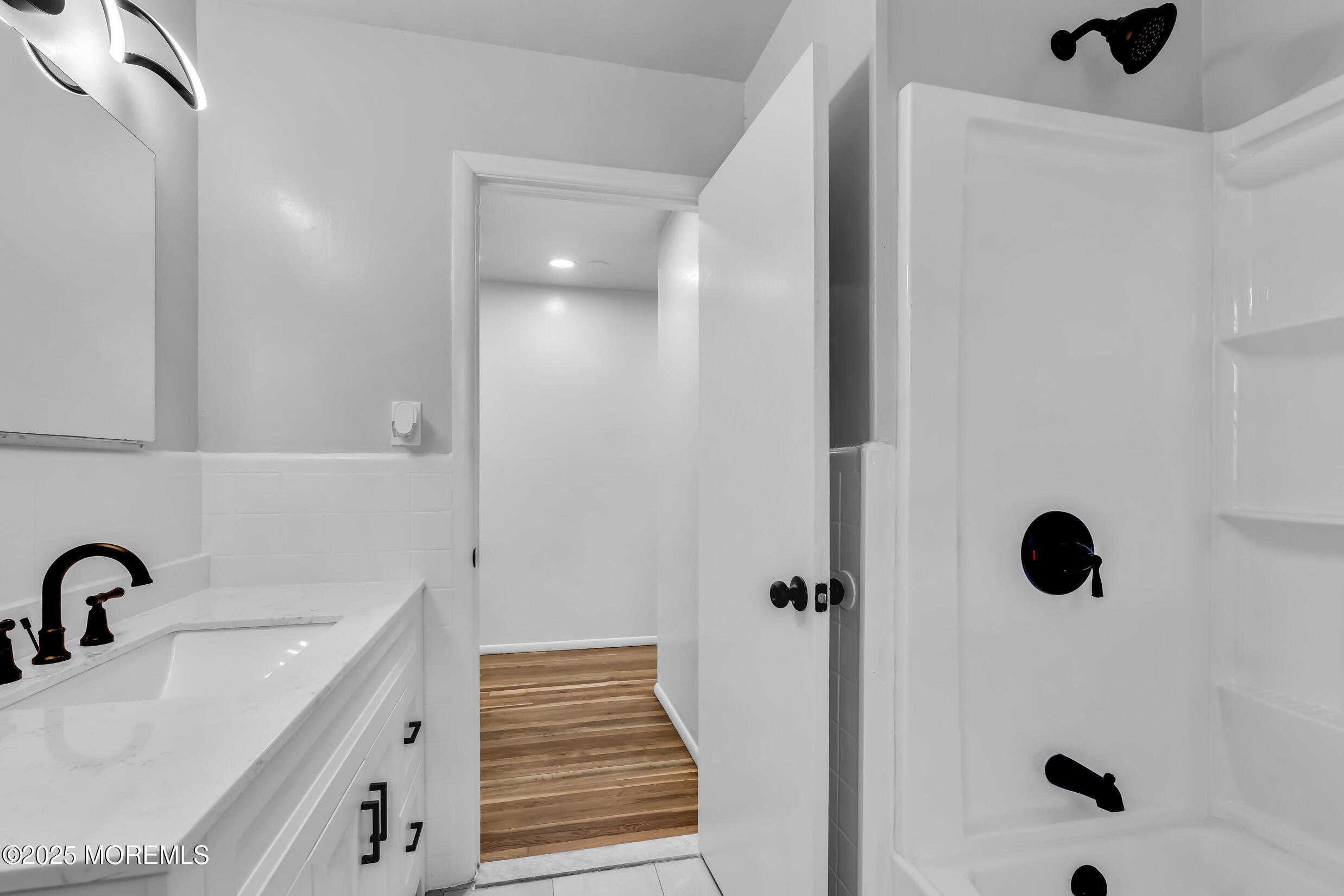 16 Burdge Drive Howell, NJ 07731 - Photo 19 of 43 a bathroom with a sink and mirror with shower