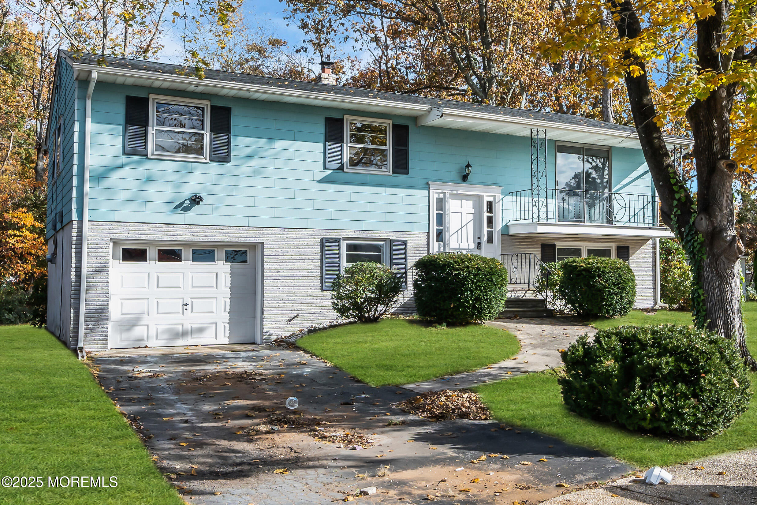 16 Burdge Drive Howell, NJ 07731 - Photo 2 of 43 a front view of a house with a garden and plants