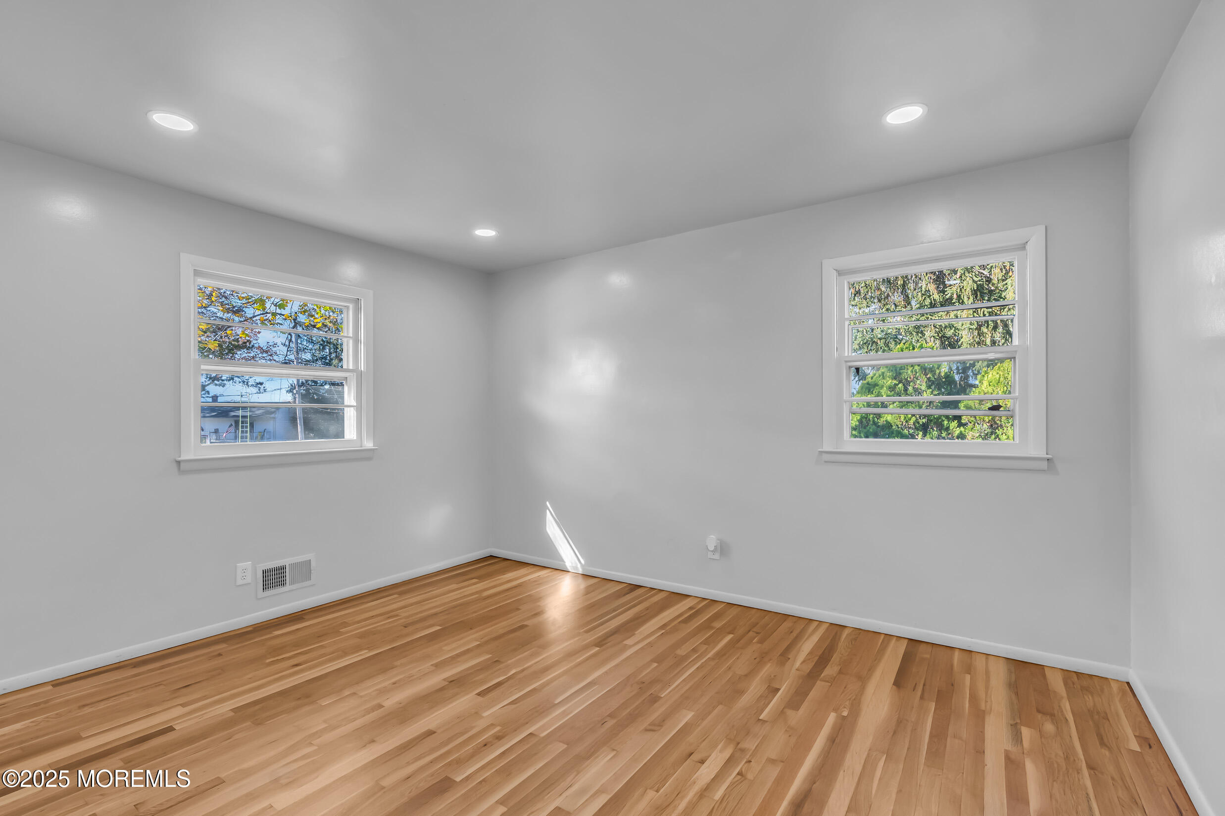 16 Burdge Drive Howell, NJ 07731 - Photo 24 of 43 a view of empty room with window and wooden floor
