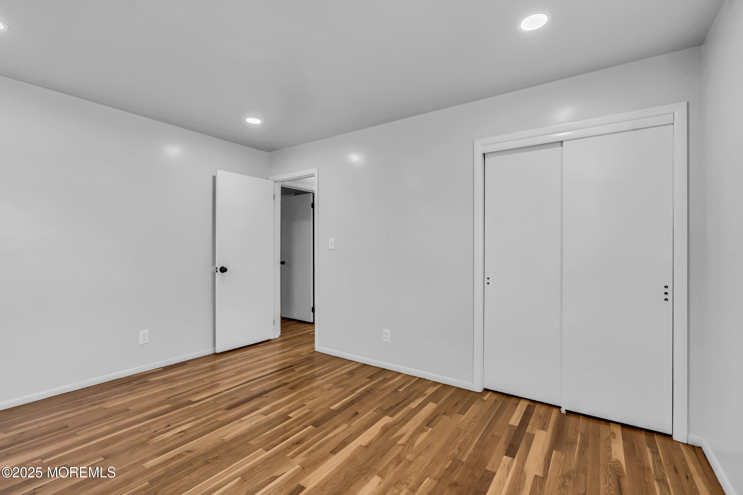 16 Burdge Drive Howell, NJ 07731 - Photo 25 of 43 a view of empty room with wooden floor
