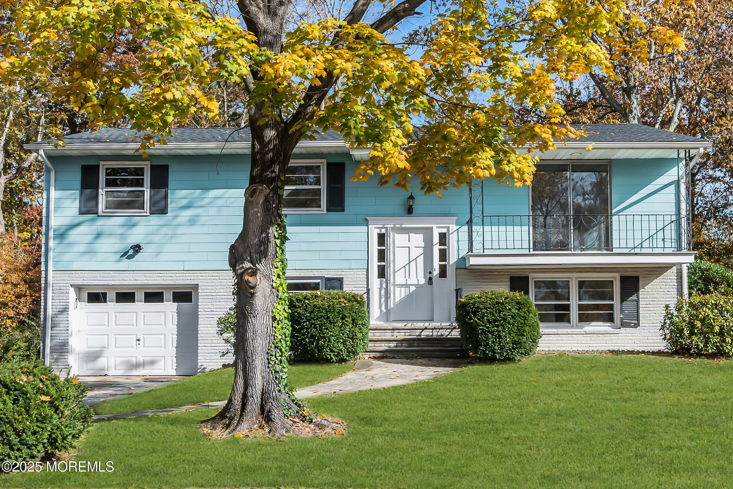 16 Burdge Drive Howell, NJ 07731 - Photo 3 of 43 a front view of a house with a yard and trees