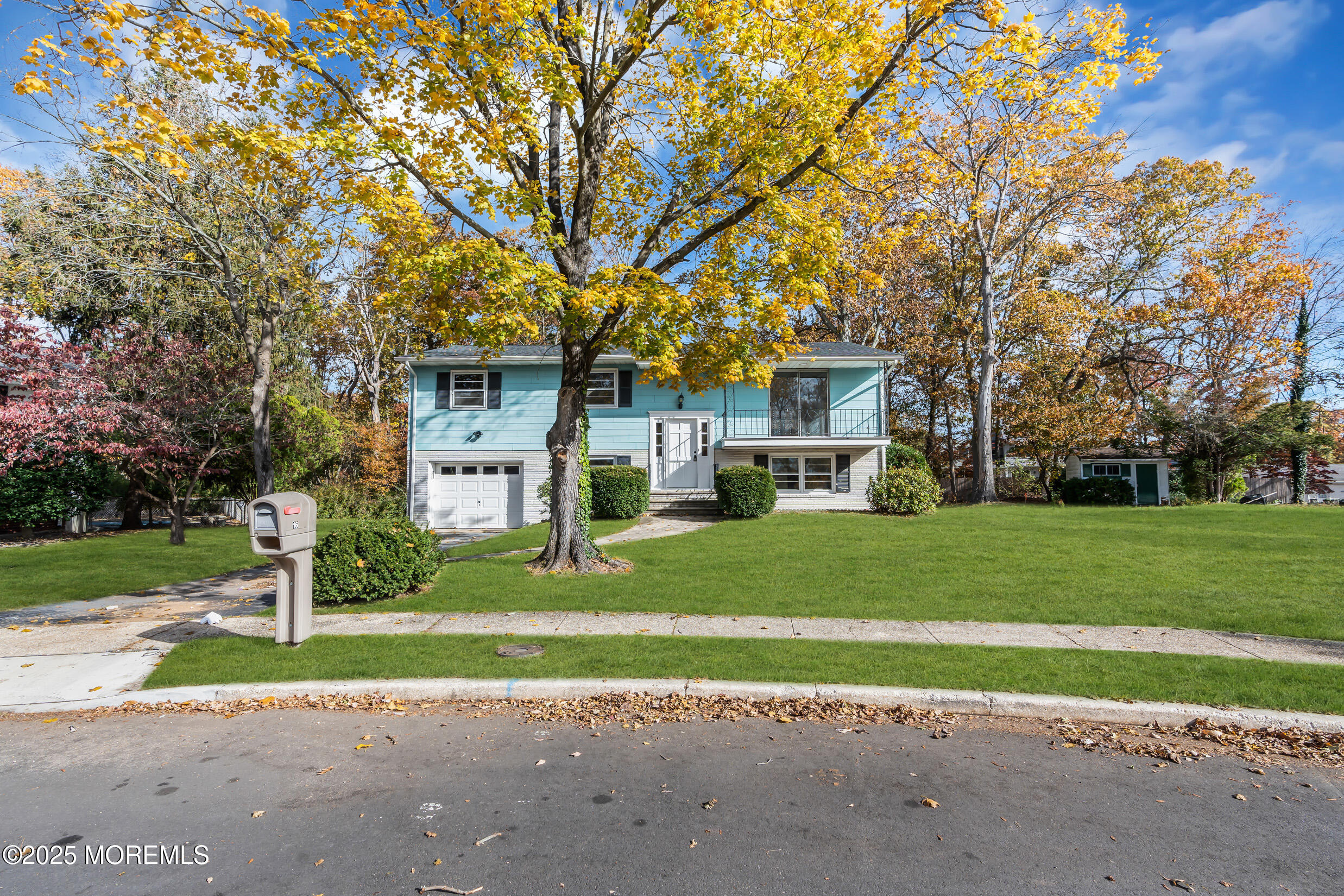16 Burdge Drive Howell, NJ 07731 - Photo 41 of 43 a front view of a house with a garden and trees
