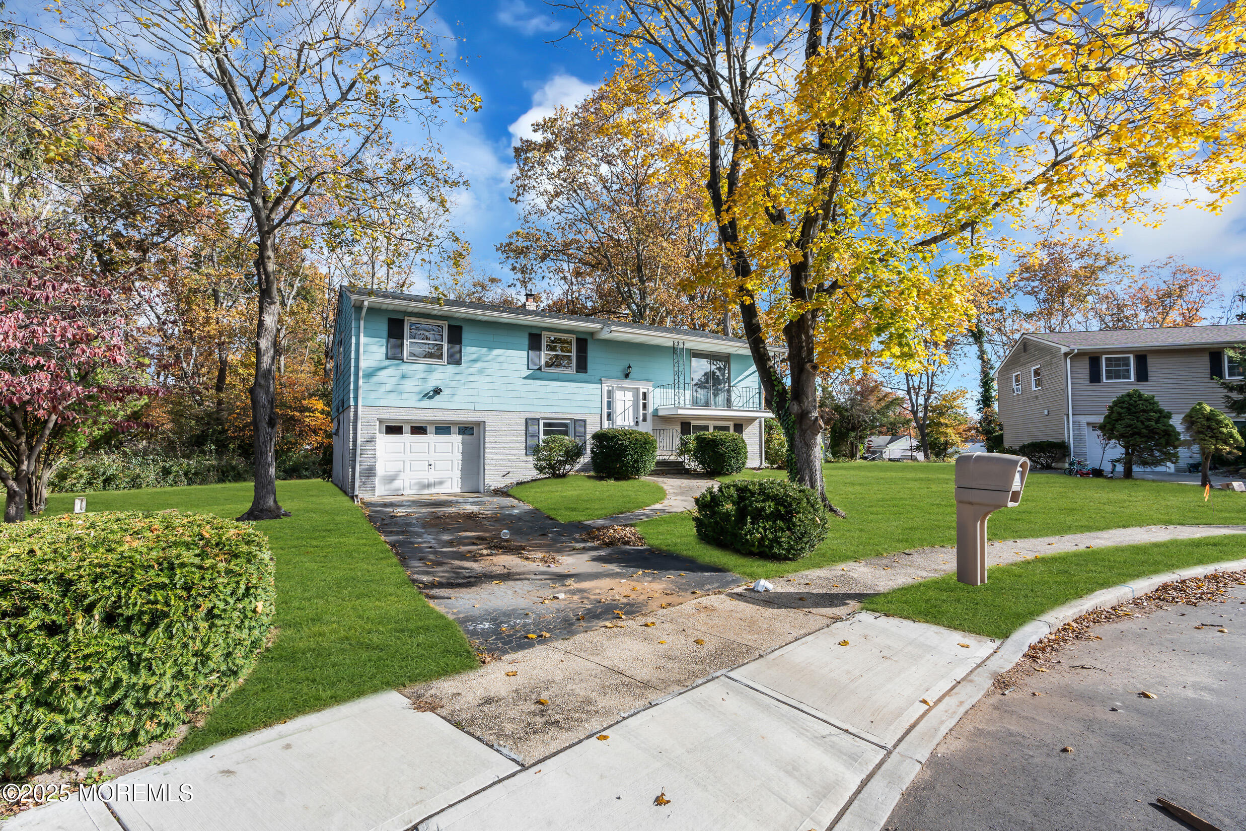16 Burdge Drive Howell, NJ 07731 - Photo 43 of 43 a front view of a house with a yard and potted plants