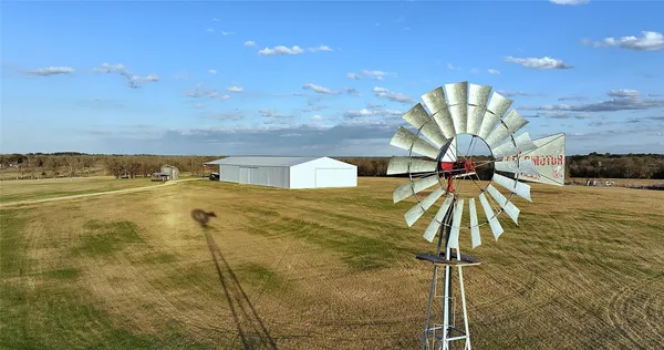 a blue swimming pool with a terrace