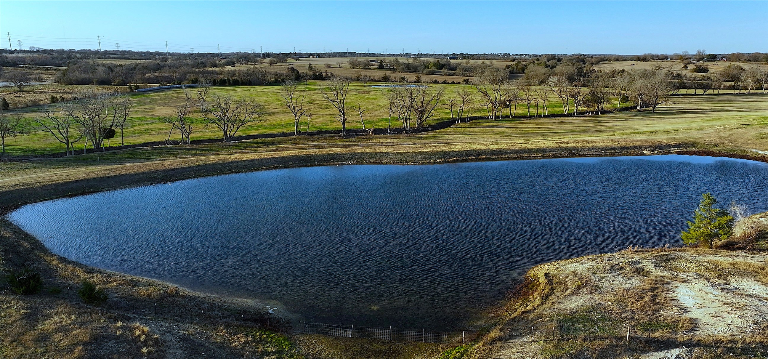 3283 Fm 2562 Road Anderson, TX 77830 - Photo 2 of 50 a view of a lake with a mountain