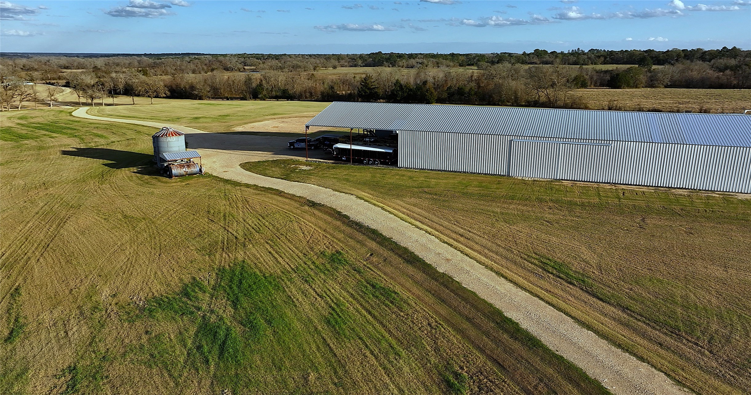 3283 Fm 2562 Road Anderson, TX 77830 - Photo 31 of 50 a view of a lake with a yard and a large tree