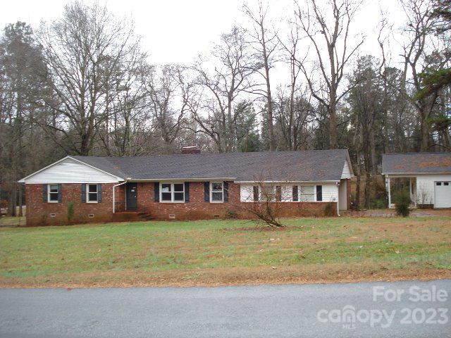 130 Nottingham Road Salisbury, NC 28147 - Photo 1 of 17 a front view of a house with a garden