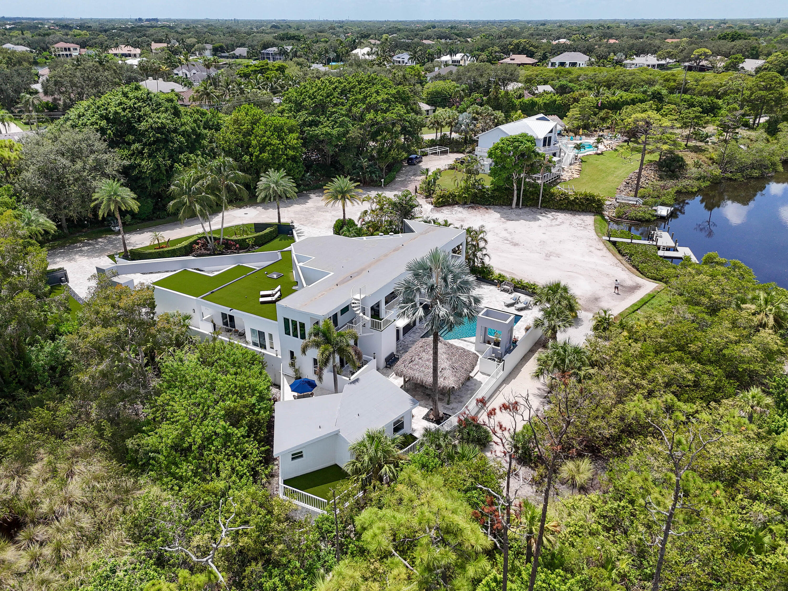 10561 Southeast Le Parc Jupiter, FL 33469 - Photo 2 of 80 an aerial view of a house with a yard