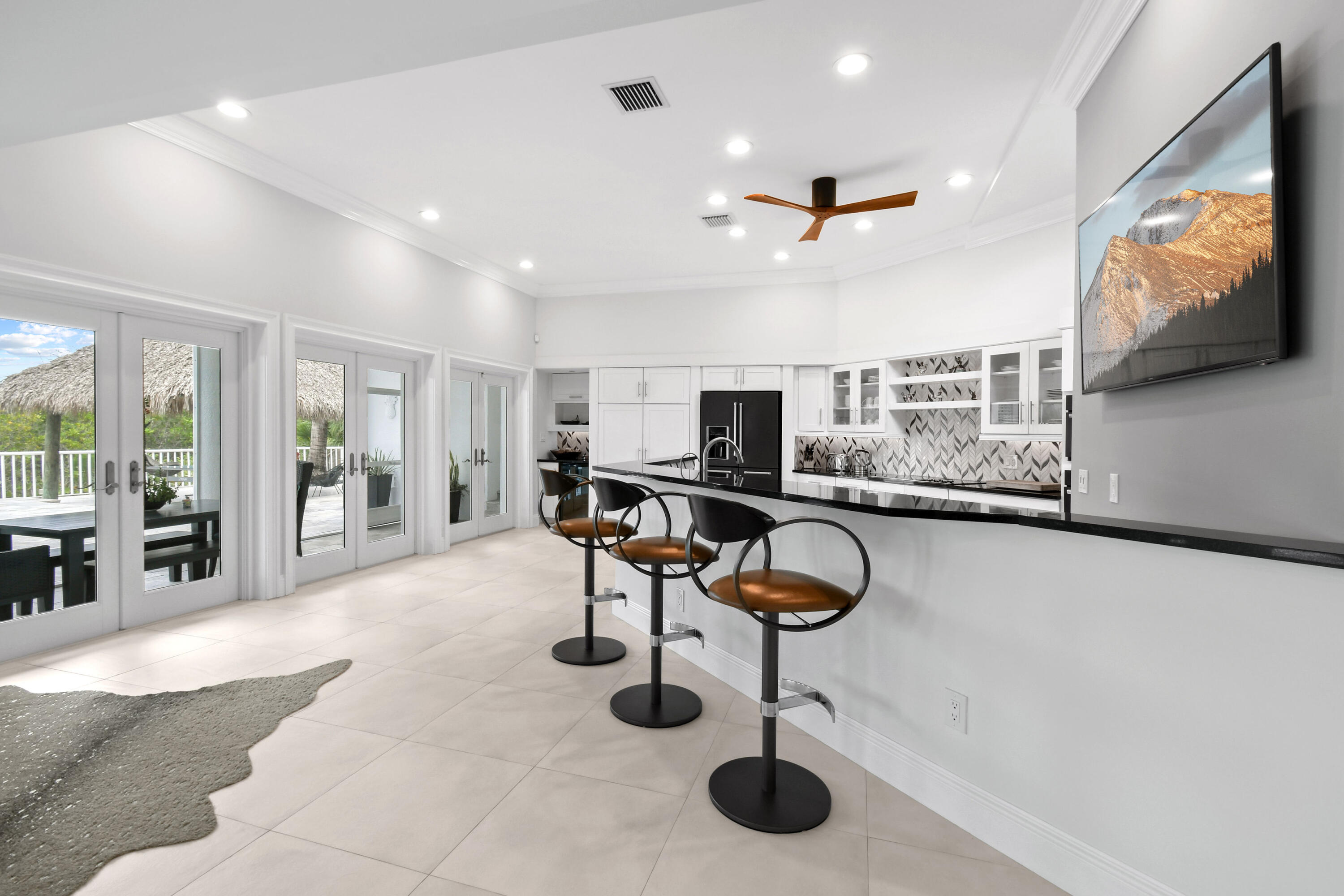 10561 Southeast Le Parc Jupiter, FL 33469 - Photo 23 of 80 a view of a livingroom with furniture and a flat screen tv