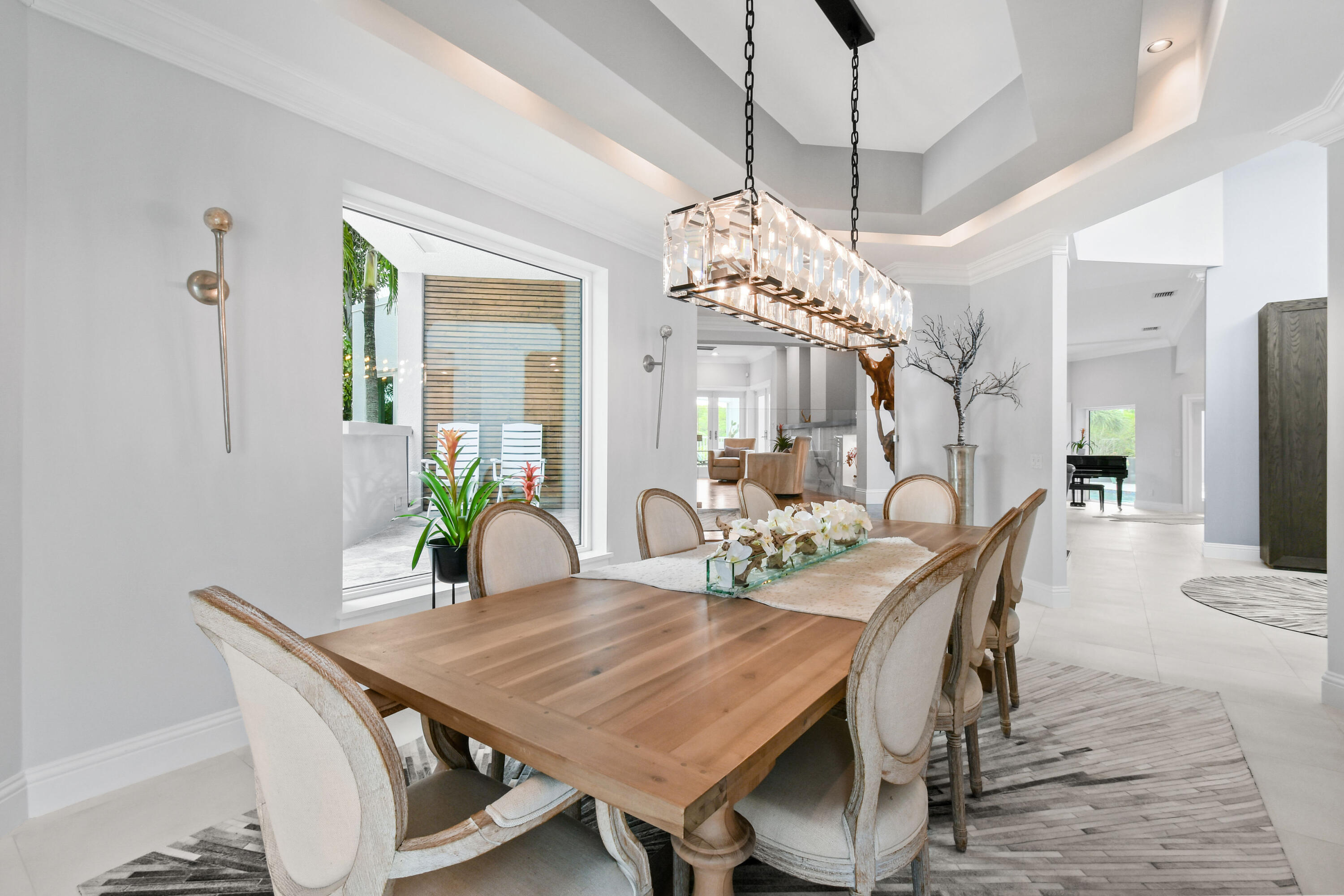 10561 Southeast Le Parc Jupiter, FL 33469 - Photo 27 of 80 a view of a dining room with furniture and chandelier