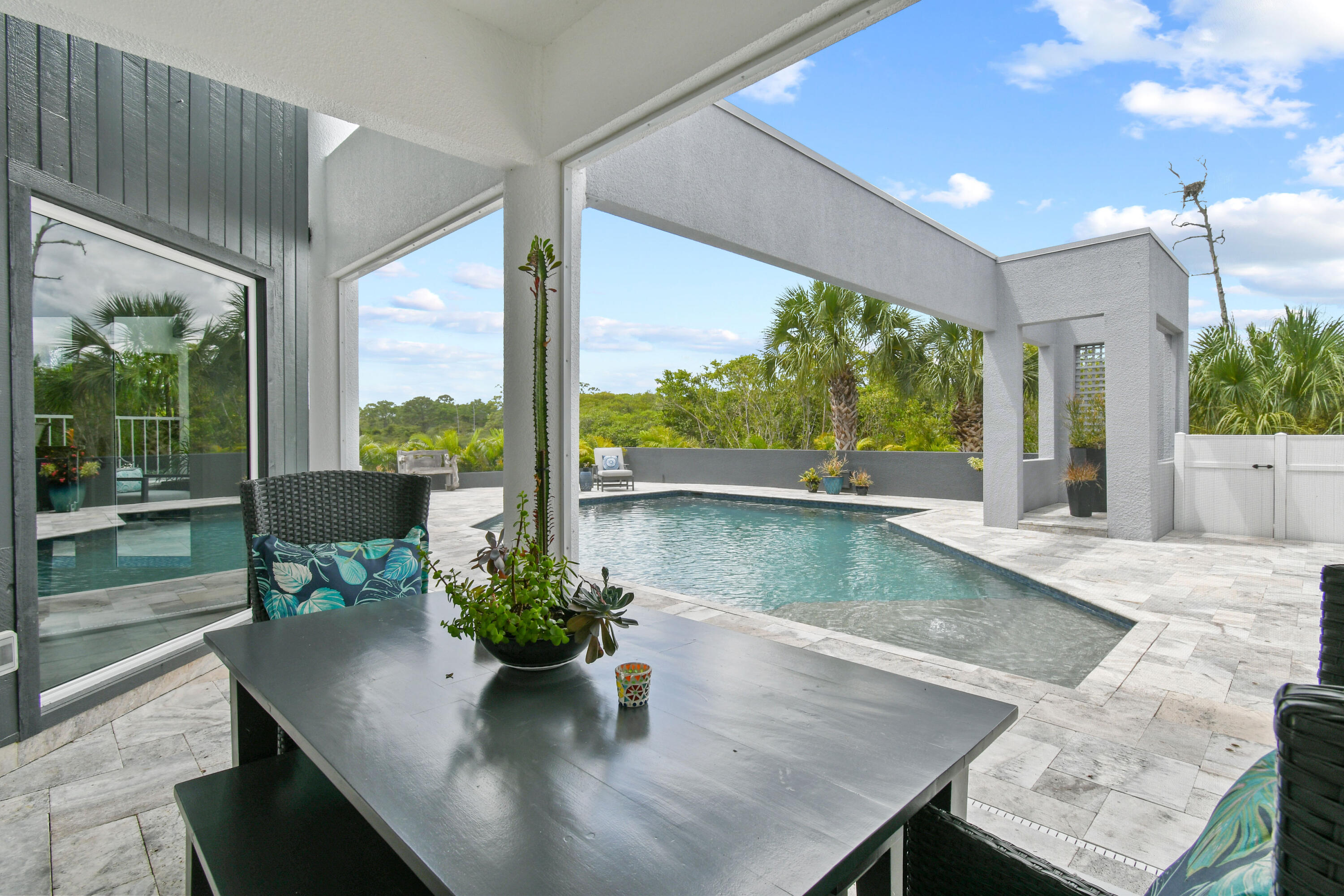 10561 Southeast Le Parc Jupiter, FL 33469 - Photo 67 of 80 a view of a dining room with furniture window and wooden floor