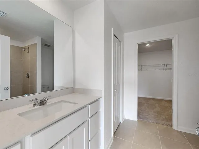 a bathroom with a shower and a toilet